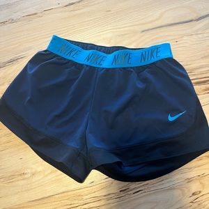 Women’s Nike Shorts - Blue with black. Size Medium